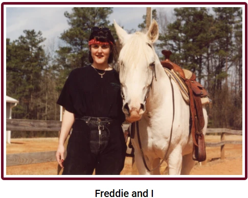 Freddie and I: Joanne Wesloske standing beside Freddie, a white Arabian horse.